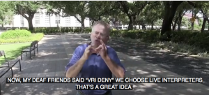 Man uses sign language for interpreter and captions read: "My friends said 'VRI Deny. We choose a live interpreter.' That's a great idea."