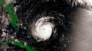 Picture of a swirling hurricane in the ocean heading toward Florida.