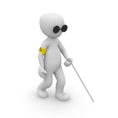 A three-dimensional white figure wears glasses, walks with a white cane, and has a yellow arm band with three black dots.